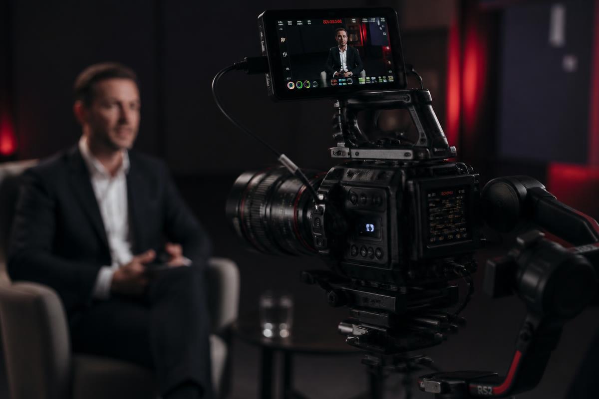 Professional cinema camera filming a corporate interview